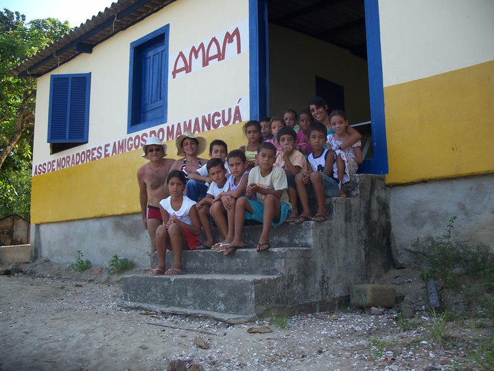 children with EV members in front AMAM School